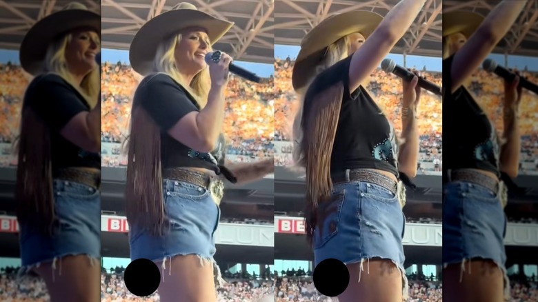 Miranda Lambert sjunger på scenen under en konsert i kort kjol