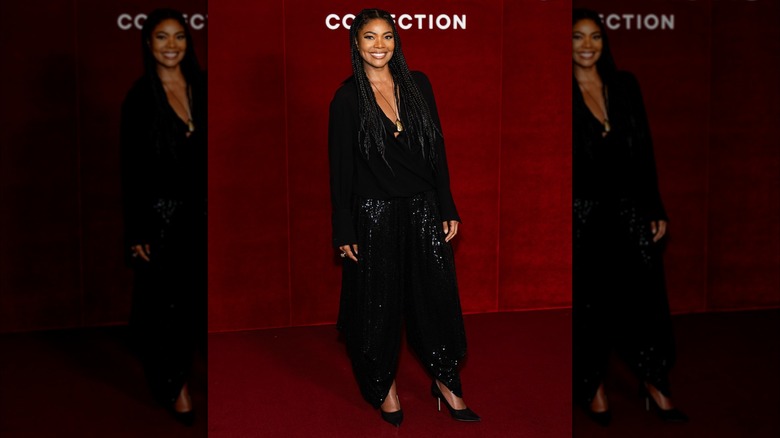 Gabrielle Union i en svart jacka och fluffiga byxor
