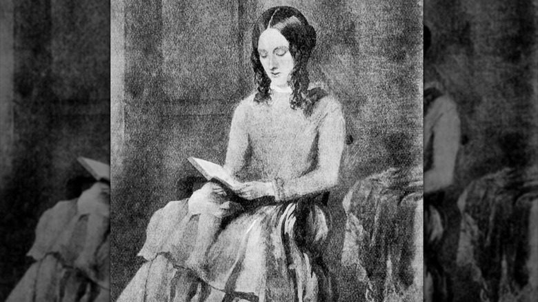 Porträtt av Charlotte Brontë som läser en bok