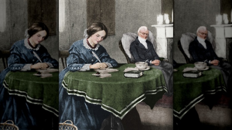 Porträtt av Charlotte Brontë som skriver på papper vid ett bord